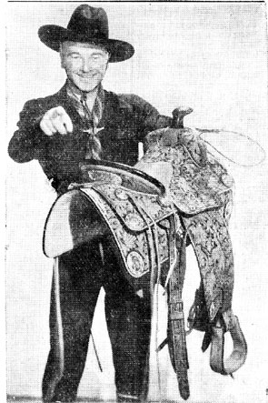 William Boyd holds the prize saddle that was given to the winner of the Hopalong Cassidy Most Colorful Cowboy or Cowgirl Contest which was held in conjunction with the premiere of “In Old Mexico” at the Plaza Theatre in El Paso, Texas in July, 1938. Boyd, Geroge “Windy” Hayes and Russell Hayden and his wife-to-be leading lady Jane (Jan) Clayton all made personal appearances for the premiere.