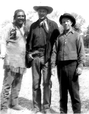 Bit player Tony Urchel and stuntman Whitey Hughes pose with Gary Cooper.