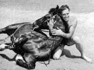 Ever the sportsman, 6'4" Jocko and his horse Rebel on the beach at Paradise Cove, Laguna Beach, CA. 
