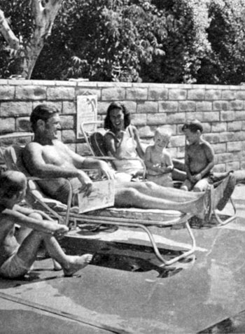 The Connors family relaxes poolside. 