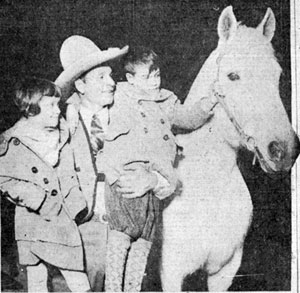 World’s Champion Cowboy Yakima Canutt with two fans as he headlined the World’s Show Sensations sponsored by the Toledo, OH Shrine club in January 1930. 