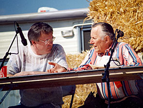 “The Rough Riders”—Jan Merlin chats with moderator Boyd Magers of WESTERN CLIPPINGS during a panel discussion in Apache Junction, AZ in the ‘90s.