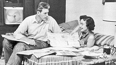 “Pony Express”—Grant Sullivan and wife Mary in their New York apartment looking at house plans in 1955. 