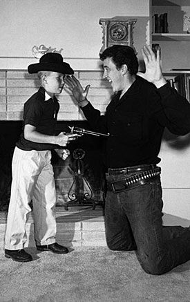 James Arness’ son Craig gets the drop on Marshal Dillon. 