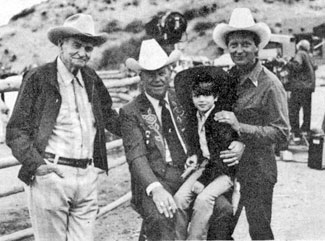 (L-R) Yakima Canutt, Rex Allen, 6 year old Scott Blair and Rex Allen Jr. on location for taping of a Merv Griffin special at Snuff Garrett’s ranch in Bell Canyon, California on June 18, 1982. The special aired in July 1982 and also featured Roy Rogers, Gene Autry and Dusty Rogers. 