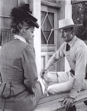 Actress Jan Shepard and “Lawman” John Russell take a break between scenes. Note the cigarette in John’s hand.