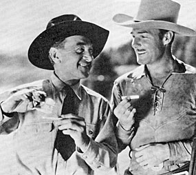 Harry Carey and Randolph Scott roll their own in between scenes of Paramount’s “Man of the Forest” (‘33).