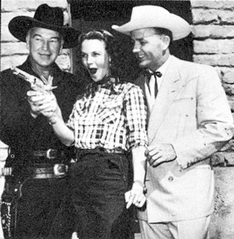 Barbara Britton and Jimmy Wakely at a birthday party for 
William Boyd...Hopalong Cassidy. 