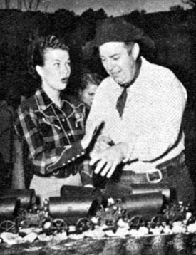 Always interested in philanthropic activities, Gale Storm and Smiley Burnette officiate at a garden party for 150 orphans. 
