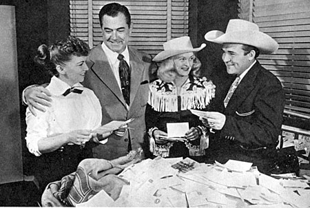In 1951 MOVIE THRILLS and MOVIE LIFE magazines ran a contest to name Whip Wilson’s horse. Contest judges (L-R) magazine editor Rae Lynn, Johnny Mack Brown, Reno Browne and Whip Wilson. 