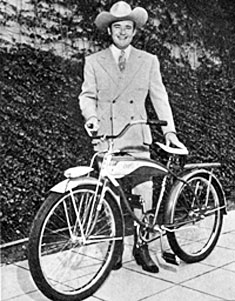 Whip Wilson with the Columbia Three-Star Deluxe bicycle which went to first prize winner Ivan Schere of Brooklyn, NY, who named Whip’s horse “Rocket”.