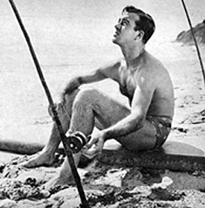 John Payne takes a break from filming to go fishing at Malibu Cove in 1947. 