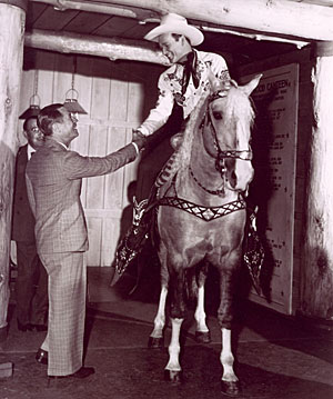 Roy greets comedian Joe E. Brown at the Hollywood Canteen. 