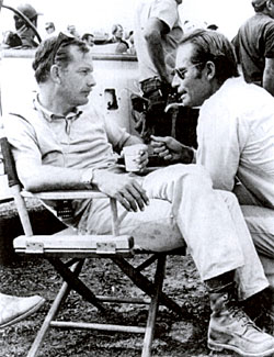 Charlton Heston (right) talks with director Sam Peckinpah while filming 
“Major Dundee” (‘65) on location.