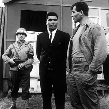 Paying a visit to the set of “The Dirty Dozen”, Muhammad Ali chats
with Clint Walker. 