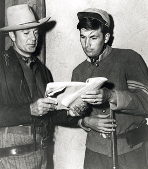 Gary Cooper and Fess Parker study the script for “Springfield Rifle” (‘52 Warner Bros.). (Thanx to Neil Summers.)