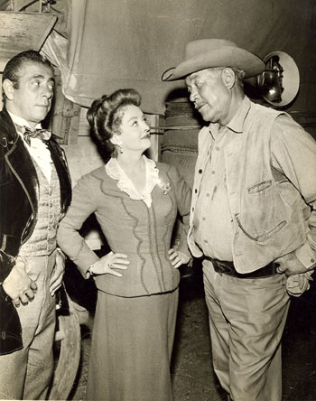 Robert Strauss, Bette Davis and Ward Bond as wagonmaster Major Seth Adams during a lull in shooting for "The Elizabeth McQueeney Story" episode of NBC’s "Wagon Train" in 1959.
