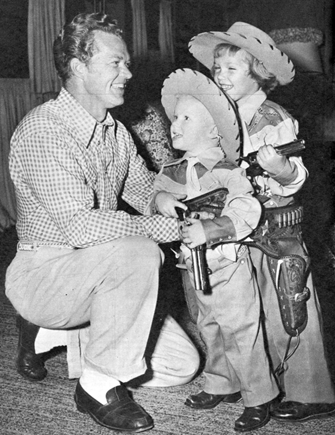 Bill (“Kit Carson”) Williams in 1954 with his two children William and Jody all suited up in their own Western gear. 