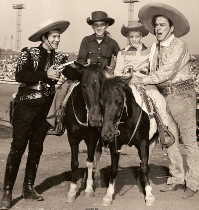 At a rodeo Duncan Renaldo (“The Cisco Kid”) and Leo Carrillo (Pancho) have a little fun with Butch and Danny Dent. (Courtesy Johnny Dent.) 