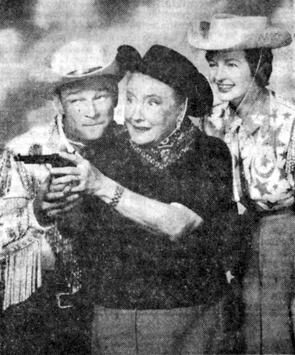 Opera singer Helen Trauble learns how to hold a gun on a visit to a dude ranch with Roy and Dale on TV. 