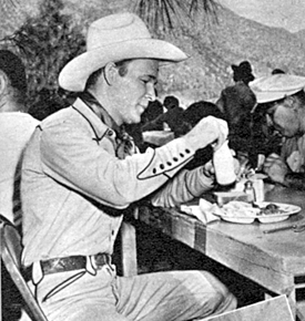 Roy grabs a bite on location in 1945. 