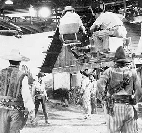 Setting up a shot in front of the relay station for “Stagecoach to Fury” (‘56 Fox) with Wright King facing down some banditos. 