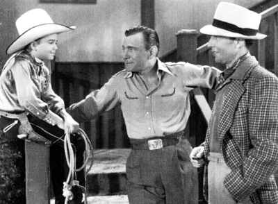 Young Dick Jones visits with Buck Jones and actor Lester Dorr. 