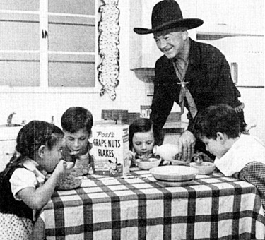 Hopalong Cassidy pours some milk for four children enjoying their Grape Nuts Flakes. General Foods sponsored Hoppy’s radio show Sundays on Mutual. 