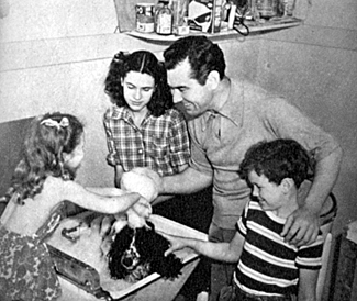 It takes Johnny Mack Brown and three of his children in November 1944 to persuade Buddy for his weekly scrub down. (L-R) Cynthia, 5 and a half, Jane, fourteen and Lachlan. 