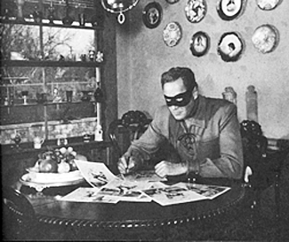 The Lone Ranger (Clayton Moore) signs autographs at his home. 