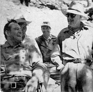 John Wayne and John Ford enjoy a laugh in Monument Valley while filming “The Searchers”.