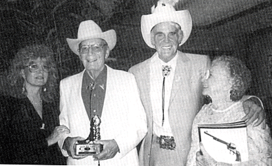 Fred Scott receiving a Golden Boot Award in 1988. Fred’s daughter, Brenda, is on his right with Sunset Carson and Fred’s wife Mary on his left.