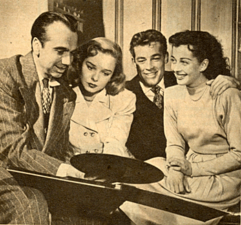 Noted agent Henry Willson with Diana Lynn, Guy Madison and Gail Russell ready to listen to a Harry James record in 1946. 