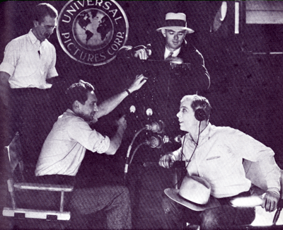 Hoot Gibson with the sound engineers on the set of “The Long, Long Trail” in 1929.