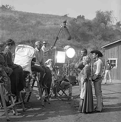 Lights, Camera...John Smith, Spring Byington and Robert Fuller ready for action on an episode of “Laramie”. Notice the teleprompter next to the light. (Thanx to Terry Cutts.) 