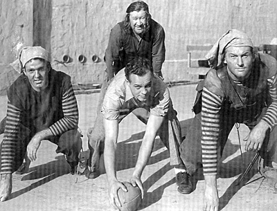 Four former All-American gridiron stars worked together on Warner Bros.’ “Captain Blood” (‘35). (L-R) Dale Van Sickel (later a renown stuntman), Jess Hibbs (later a director), Paul Schwegler (briefly an actor in ‘34-‘35) and Jim Thorpe behind Hibbs.