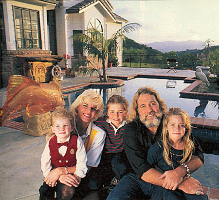 Dan (“Grizzly Adams”) Haggerty and wife Samantha at home with their three kids (L-R) Cody, Dylan and Megan.