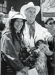 George Montgomery received the Palm Springs Golden Palm Star in the sidewalk in front of the Palm Springs Desert Museum in April of 1995. With him are his daughter Missy and grandson Alex. 