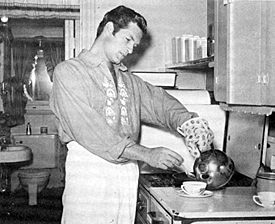 Hugh O’Brian cookin’ in his kitchen. 