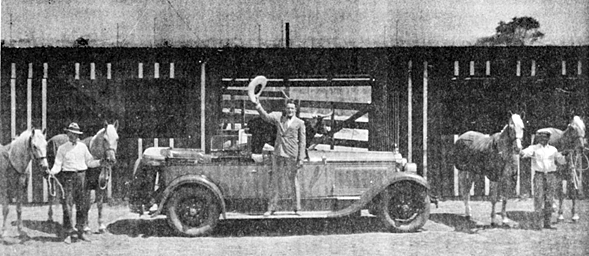 Ken Maynard stands on the running board of his Packard at Tiffany’s Calfornia Studios in 1931 during production of “Branded Men” (‘31). Trazan being held at the right. 