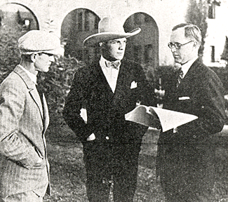 On July 23, 1927 Joseph P. Kennedy talks over the future of his new Western star, Tom Tyler, with Tom and director Robert DeLacy.