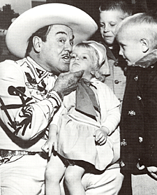 Leo Carrillo in Tucson, AZ, in November 1956 with three young fans. 