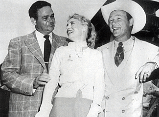 Marie (“My Friend Irma”) Wilson and Roy Rogers with an Indianapolis 
500 official in 1954. 