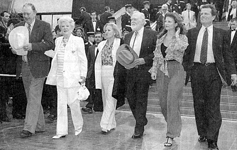 (L-R) Ben Johnson, Claire Trevor, Carroll Baker, Harry Carey Jr., Melissa and Patrick Wayne leave the Festival Palace in Cannes, France after a screening of an omage to director John Ford during the 1995 48th International Film Festival.
