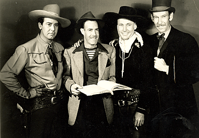 Getting ready to film the PRC Texas Rangers series in 1944...James Newill, producer/writer/director Oliver Drake, Dave O’Brien and Guy Wilkerson. Note the cigarette in O’Brien’s hand.