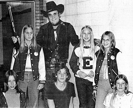 Sunset Carson with a group of Esterville, IA youngsters on October 11, 1974. Sunset was appearing at the Family Funtime Show raising money for the Emmet County Handicapped Workers Activity Center. 