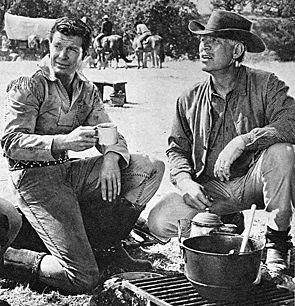 Robert Horton and Ward Bond take a coffee break while filming another episode of “Wagon Train”. 