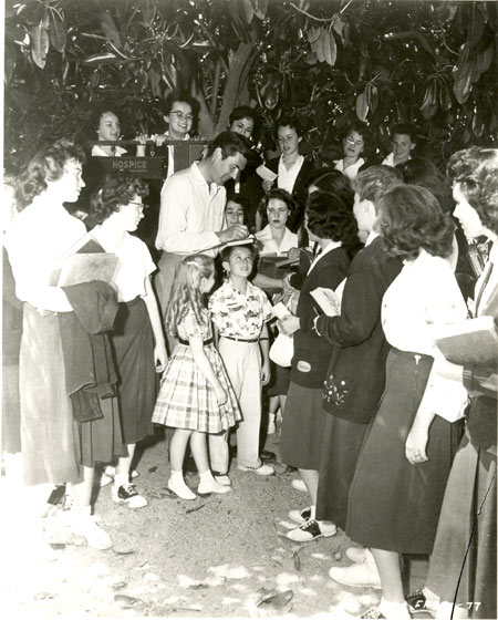 Fess Parker signs autographs for a group of “Davy Crockett” fans.
