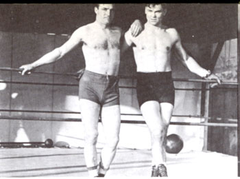 Tom Mix (L) visits boxing great Jack Dempsey for a workout in 1920.