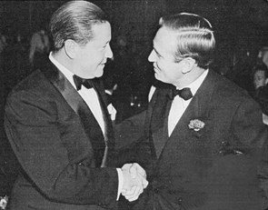 Jack Oakie greets Gene Autry at a charity dinner on November 18, 1939. 